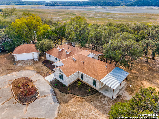 2580 Goat Hill Road Lakehills, TX 78063 - Photo 27 of 34 a view of a terrace with a lounge chair