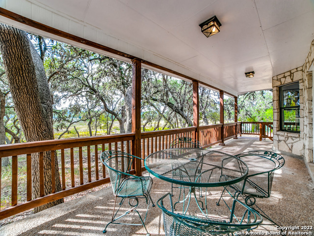 2580 Goat Hill Road Lakehills, TX 78063 - Photo 28 of 34 a view of a chairs and table in the balcony