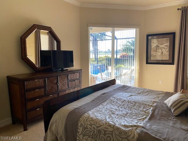 10307 Gator Bay Court Naples, FL 34120 - Photo 13 of 24 a bedroom with a bed and a television in it