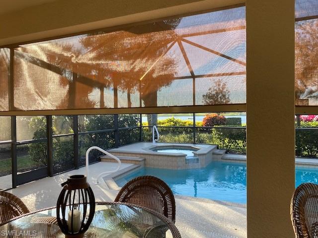 10307 Gator Bay Court Naples, FL 34120 - Photo 22 of 24 a view of a swimming pool from a balcony
