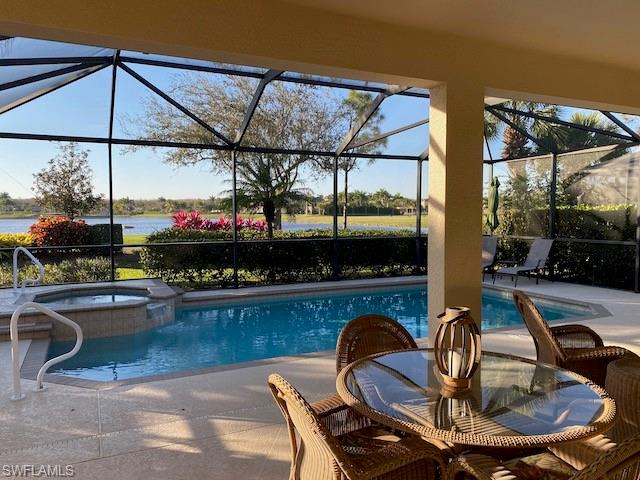 10307 Gator Bay Court Naples, FL 34120 - Photo 23 of 24 a view of a swimming pool with a patio