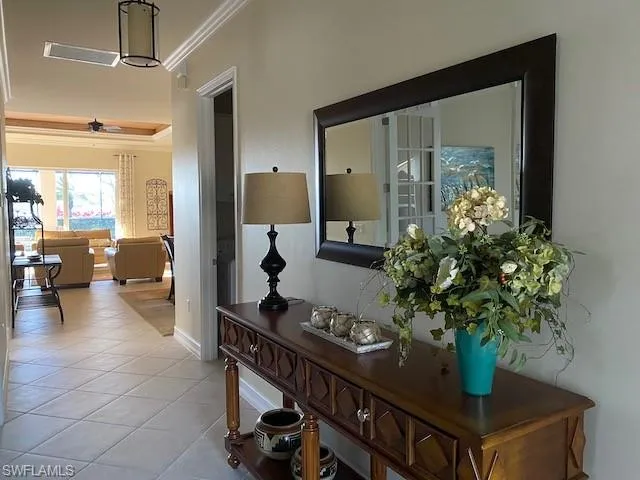 a lobby with furniture and a potted plant