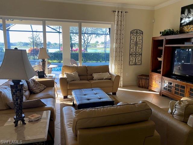 10307 Gator Bay Court Naples, FL 34120 - Photo 4 of 24 a living room with furniture and a flat screen tv