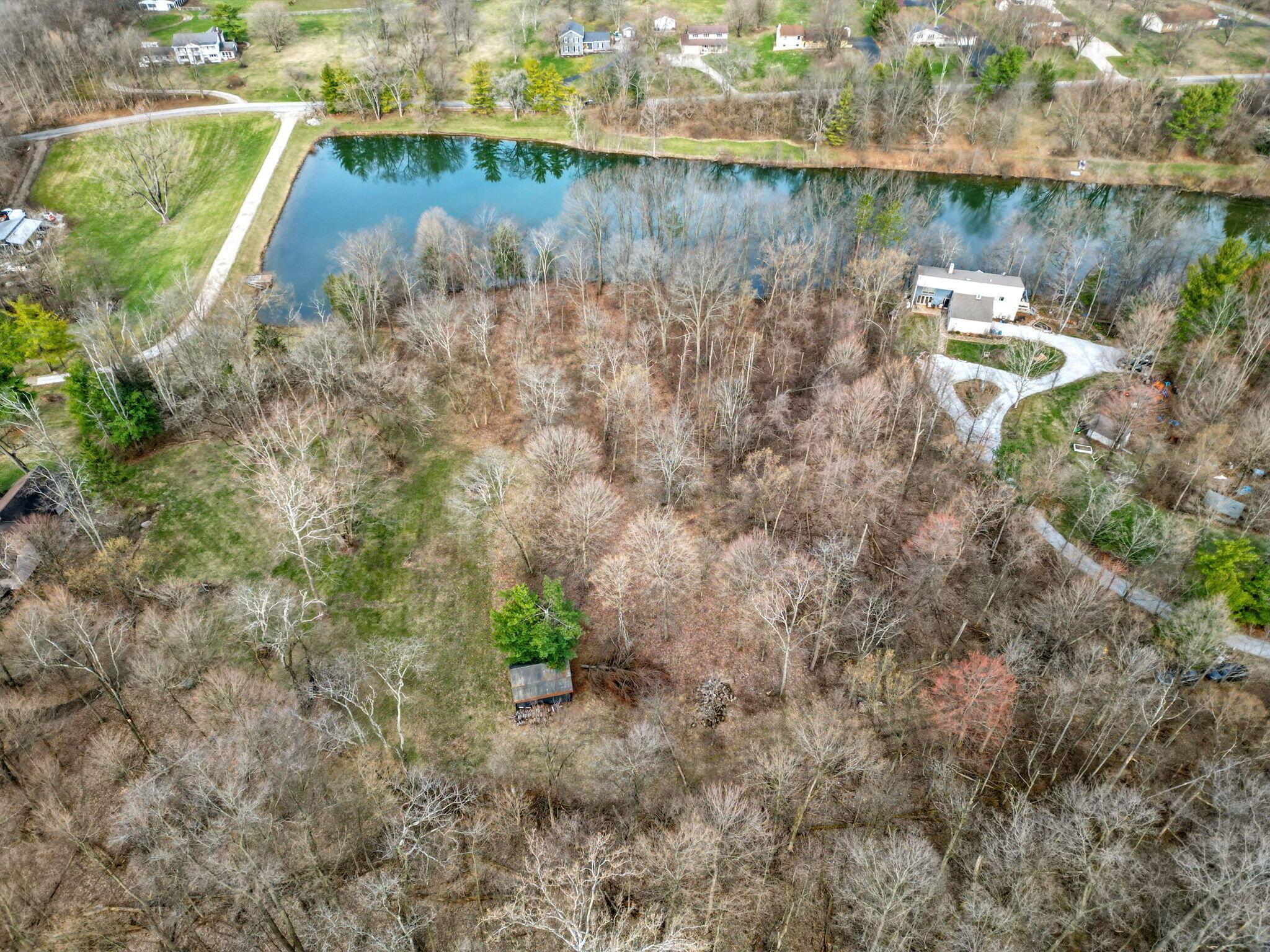 2739 Patterson Road Southwest Pataskala, OH 43062 - Photo 1 of 21 Patterson runs along the edge of the Pond (top of picture). Land to build is on the back side of the pond (bottom of picture)
