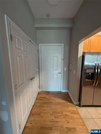 a view of a hallway view with wooden floor and staircase