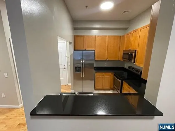 a view of kitchen with a sink dryer and washer