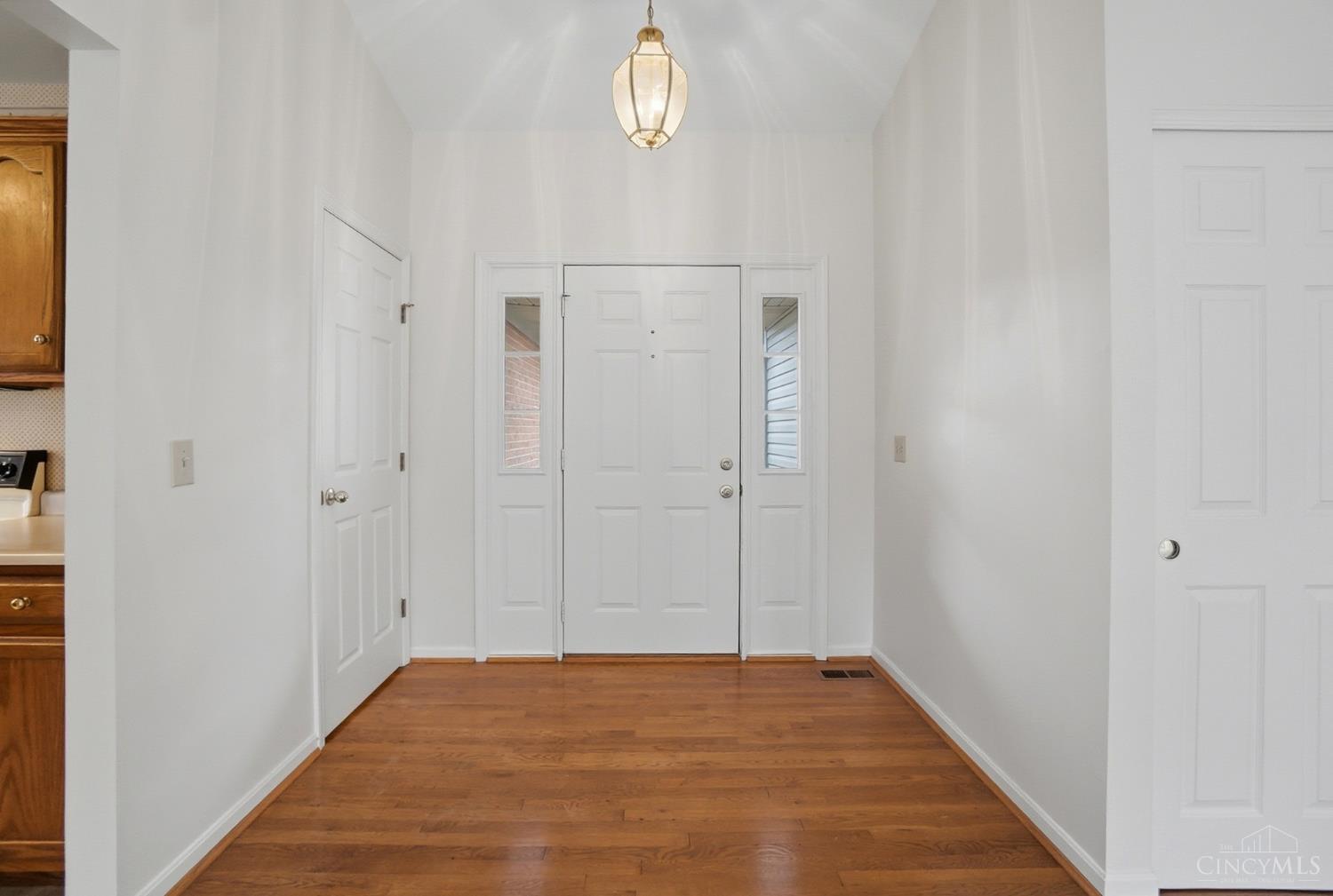 1090 West Galbraith Road Cincinnati, OH 45231 - Photo 4 of 37 Open entryway with hardwood floors and coat closet.