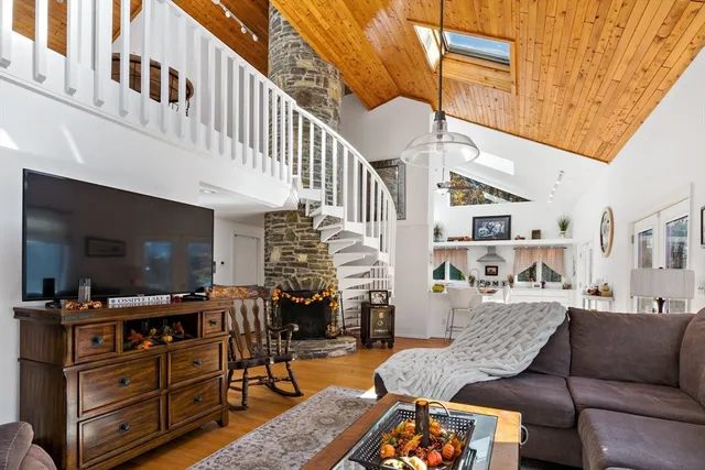 a outdoor space with lots of furniture and flat screen tv