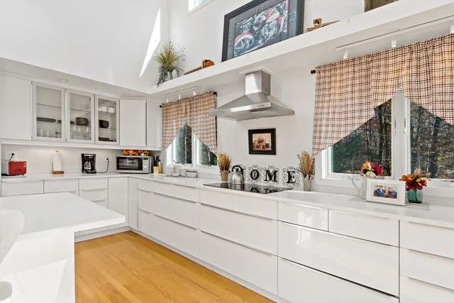 a kitchen with sink cabinets and window