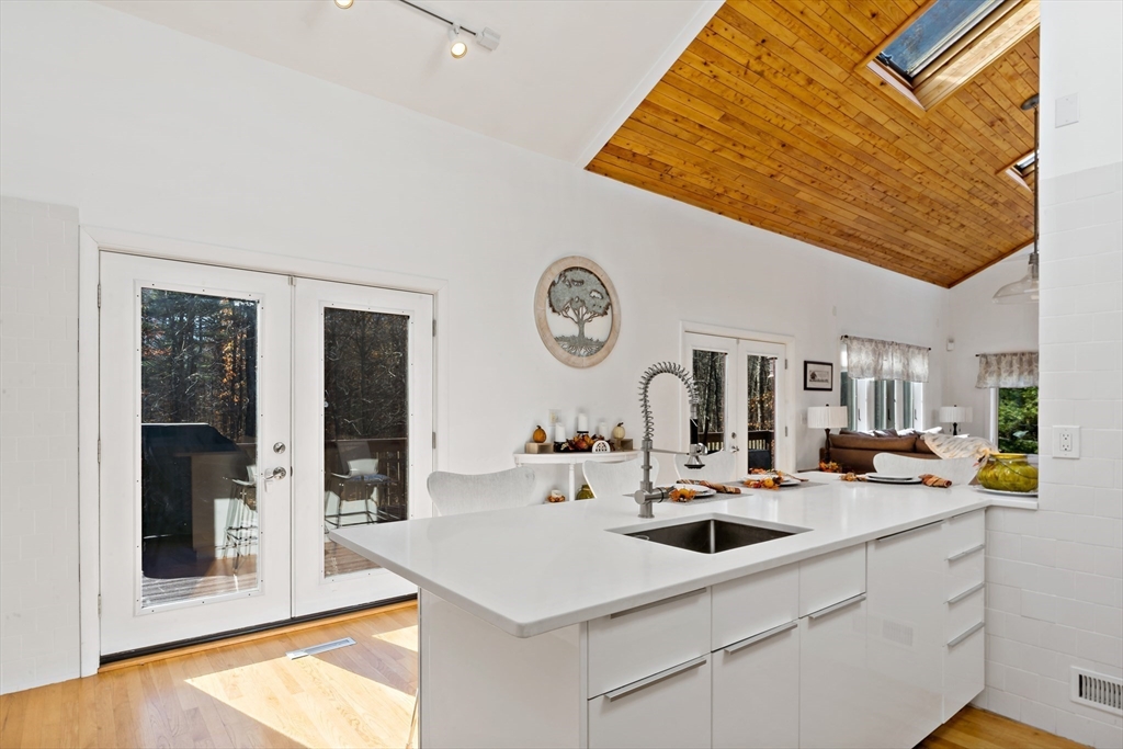 15 Carpenter Street Rehoboth, MA 02769 - Photo 21 of 42 a kitchen with a sink and a clock on the wall