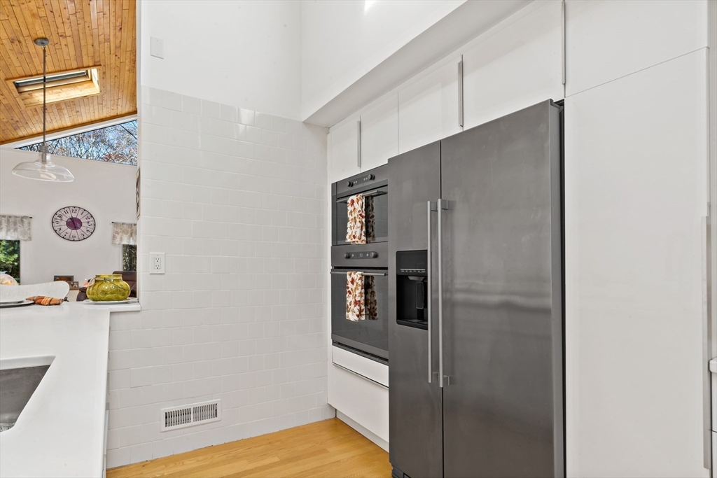 15 Carpenter Street Rehoboth, MA 02769 - Photo 24 of 42 a view of a refrigerator in kitchen and an empty room