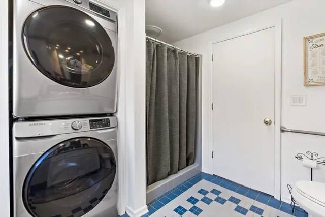 a view of a hallway with washer and dryer