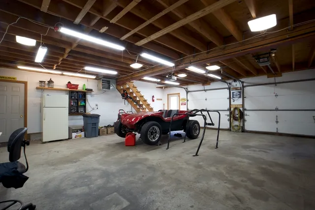 a view of a garage with a car parked