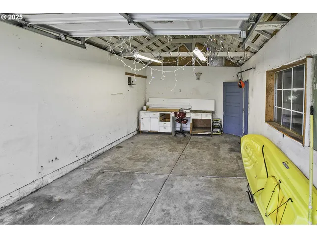 a view of a living room with a ceiling fan