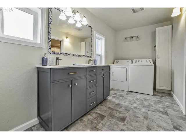 a view of a kitchen with cabinets
