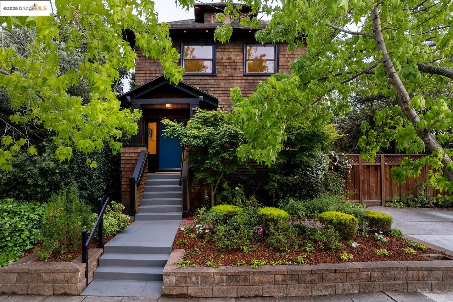 2316 Carleton Street Berkeley, CA 94704 - Photo 1 of 1 a front view of a house with a yard and potted plants