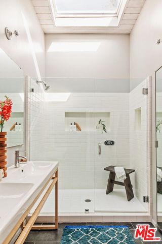 a bathroom with a bathtub and a sink