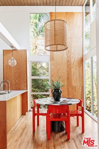 a dining room with a table and chairs