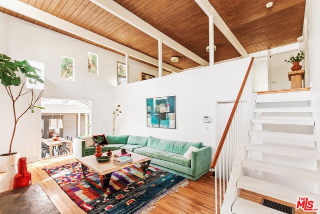 a living room with furniture and a rug