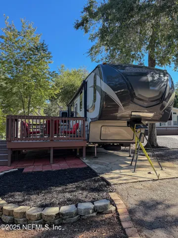 a view of a chairs and fire pit