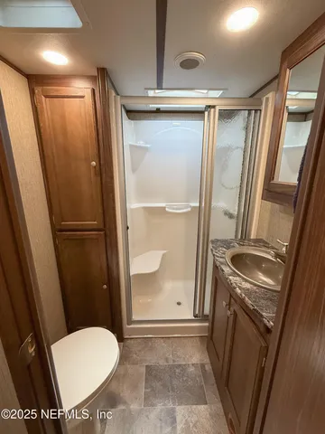 a bathroom with a sink and mirror
