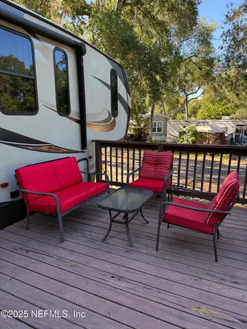 a view of a two chairs in the balcony