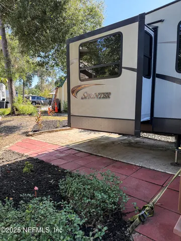 a view of a back yard of the house