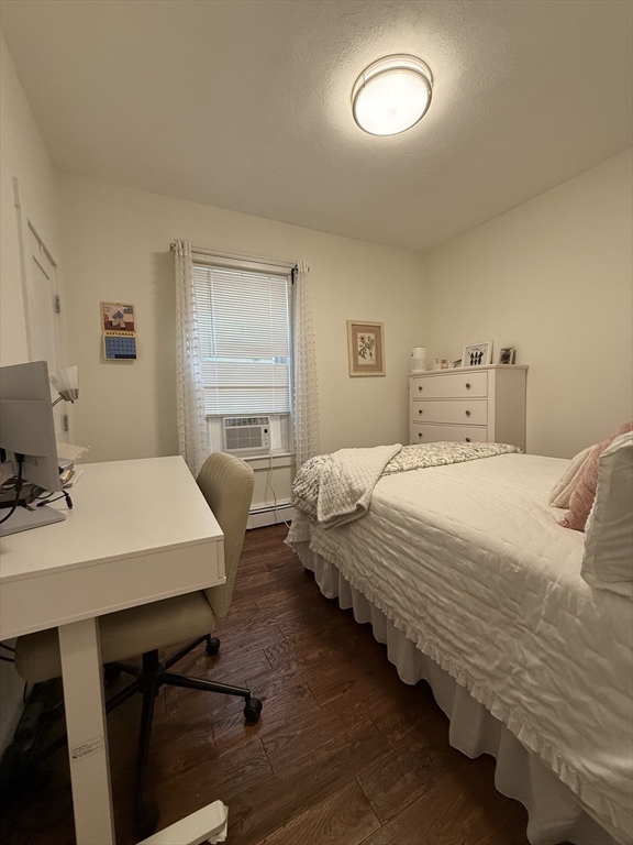 229 Charles Street, Unit 1 Cambridge, MA 02141 - Photo 13 of 19 a bedroom with bed and window