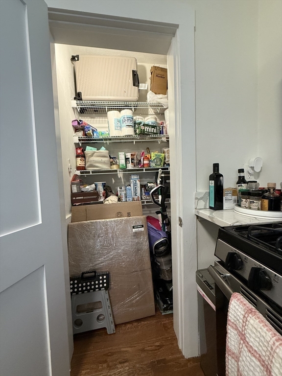 229 Charles Street, Unit 1 Cambridge, MA 02141 - Photo 19 of 19 a kitchen with stainless steel appliances granite countertop a refrigerator and a stove