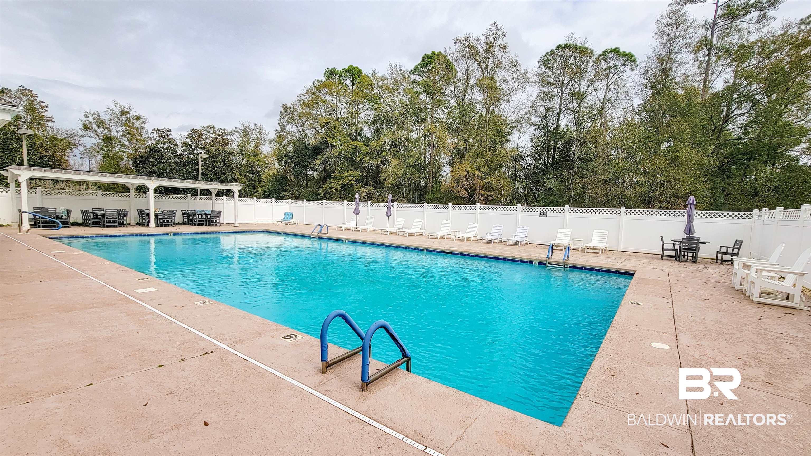 214 Hemingway Loop Foley, AL 36535 - Photo 41 of 67 Community pool with a patio area and a pergola