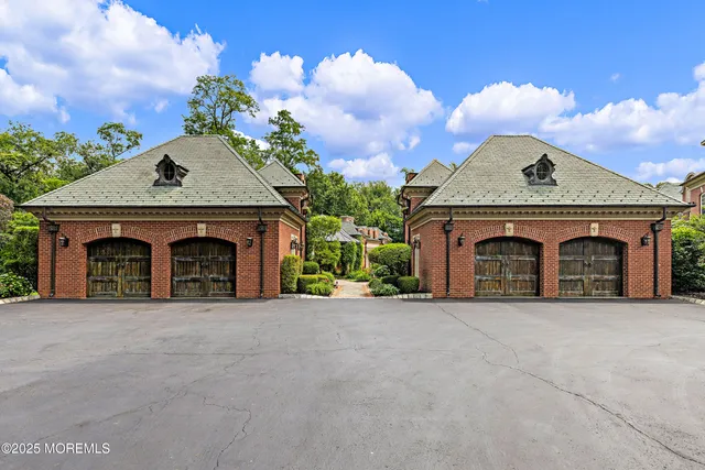 an aerial view of a house with garden space and street view