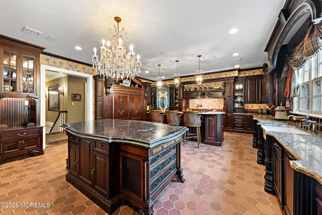 a kitchen with stainless steel appliances granite countertop a stove and a refrigerator