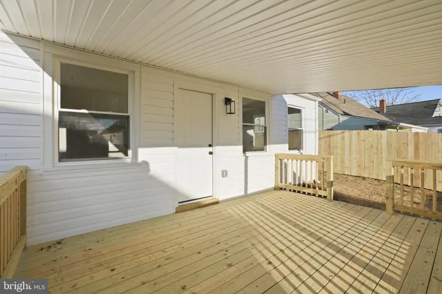a view of a balcony with wooden floor