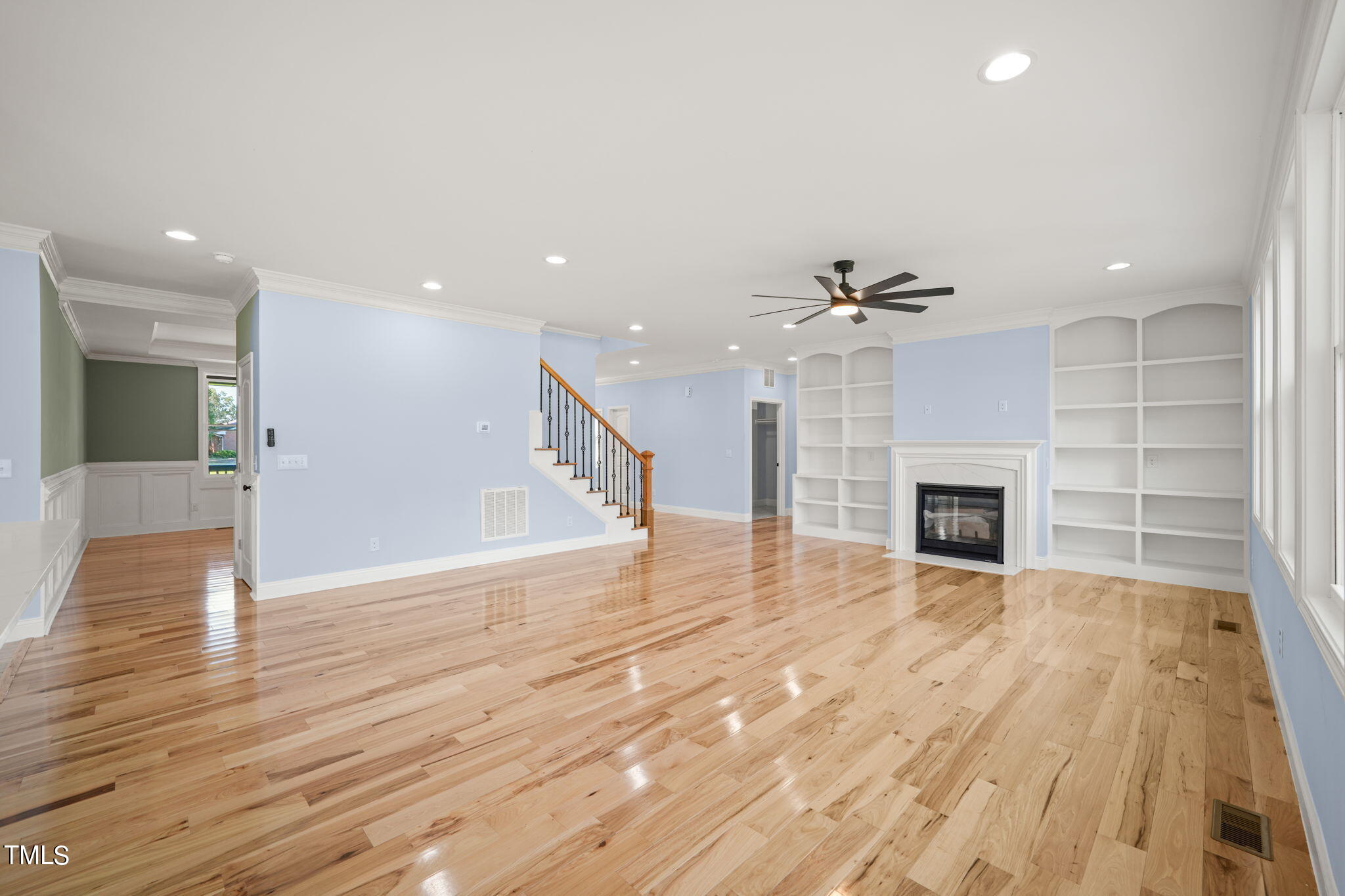 2804 Jack Mitchell Road Zebulon, NC 27597 - Photo 11 of 56 a view of empty room with wooden floor and fireplace