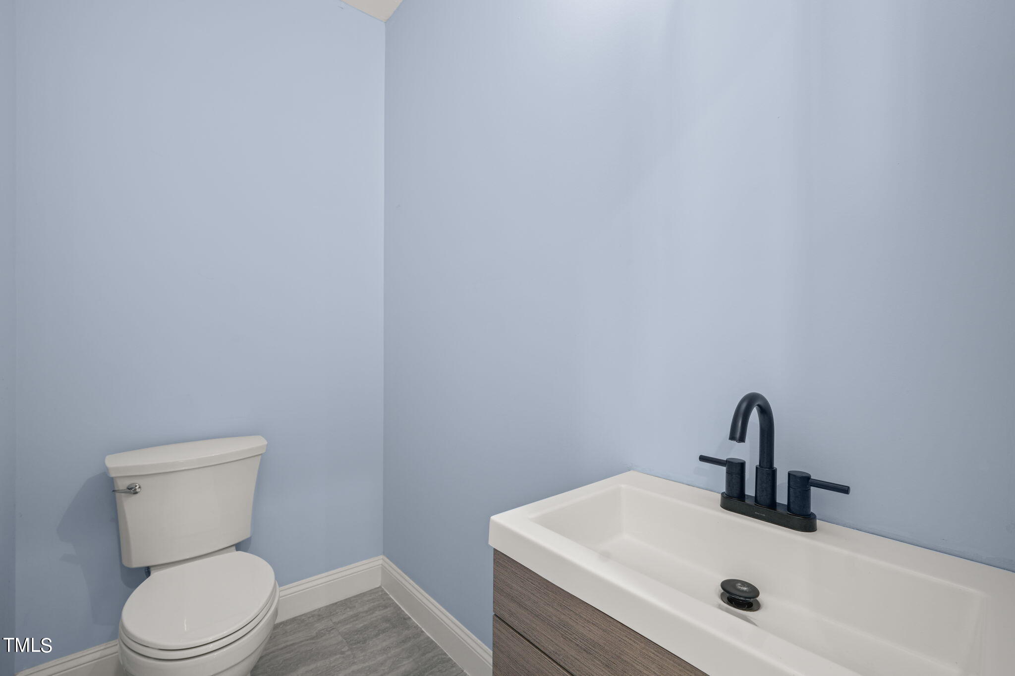 2804 Jack Mitchell Road Zebulon, NC 27597 - Photo 20 of 56 a bathroom with a sink and a toilet