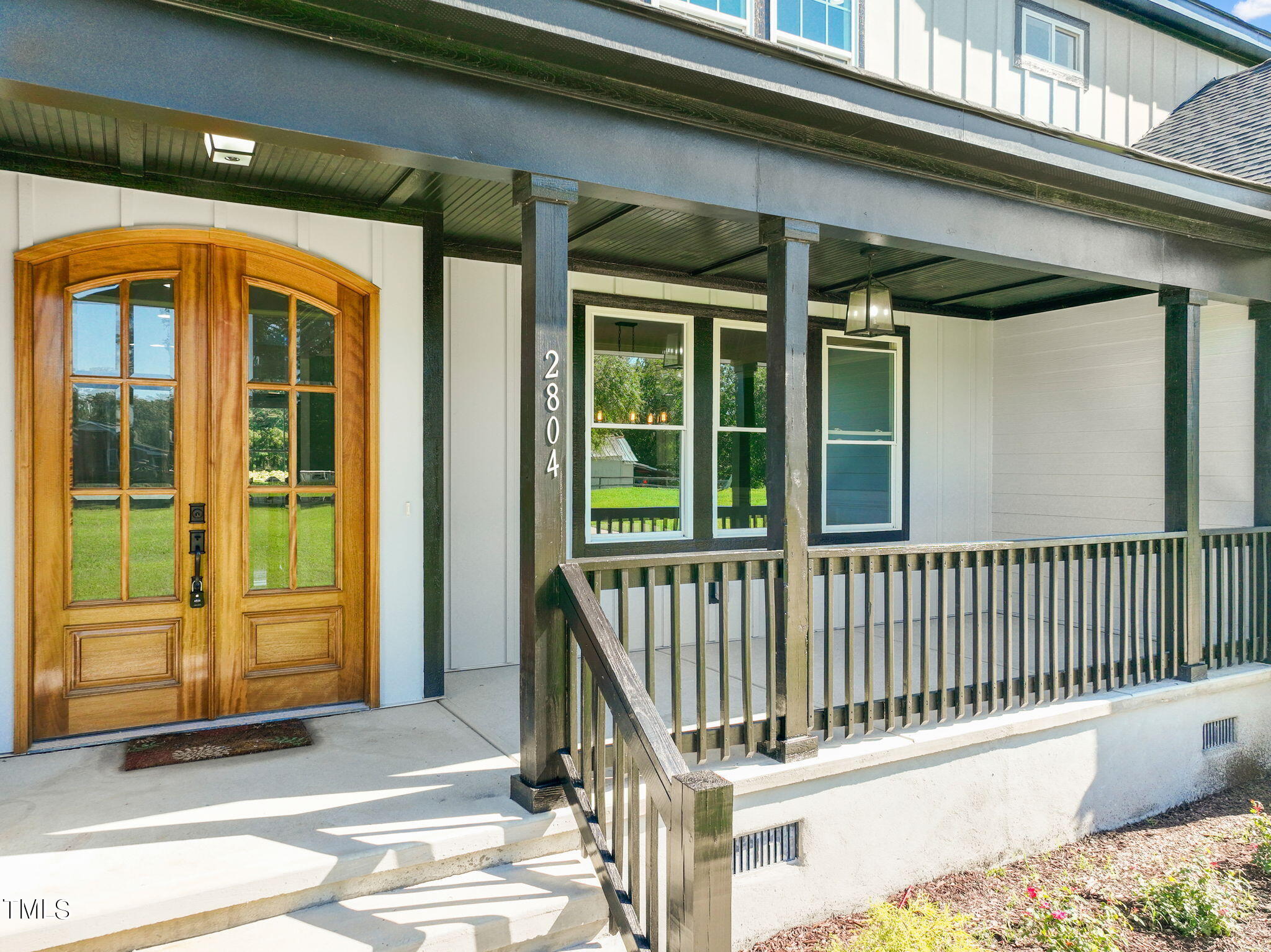 2804 Jack Mitchell Road Zebulon, NC 27597 - Photo 2 of 56 a view of a balcony with door