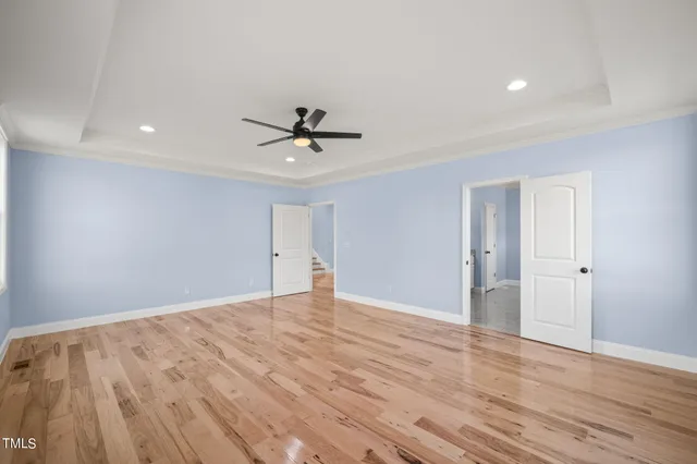 a spacious bathroom with a granite countertop sink mirror and shower