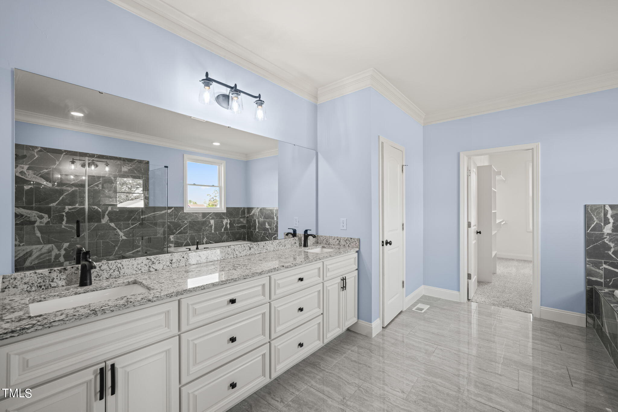 2804 Jack Mitchell Road Zebulon, NC 27597 - Photo 27 of 56 a spacious bathroom with a granite countertop sink mirror and shower