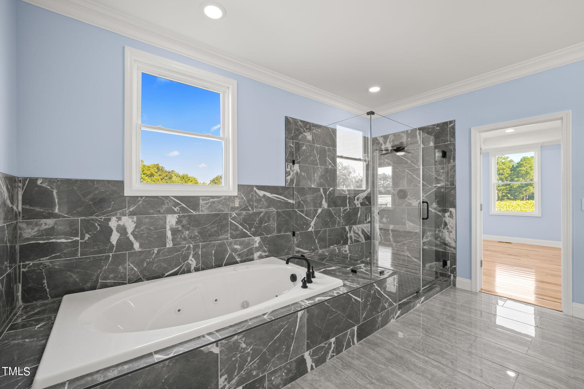 2804 Jack Mitchell Road Zebulon, NC 27597 - Photo 28 of 56 a bathroom with a tub a sink and a shower