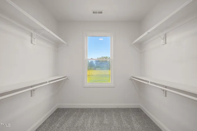 a view of an empty walk in closet