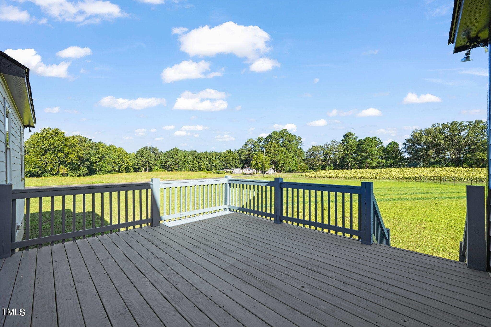 2804 Jack Mitchell Road Zebulon, NC 27597 - Photo 46 of 56 a view of balcony with wooden floor and fence