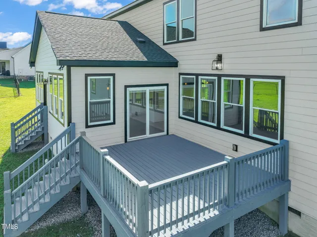 a view of a house with a yard and garage