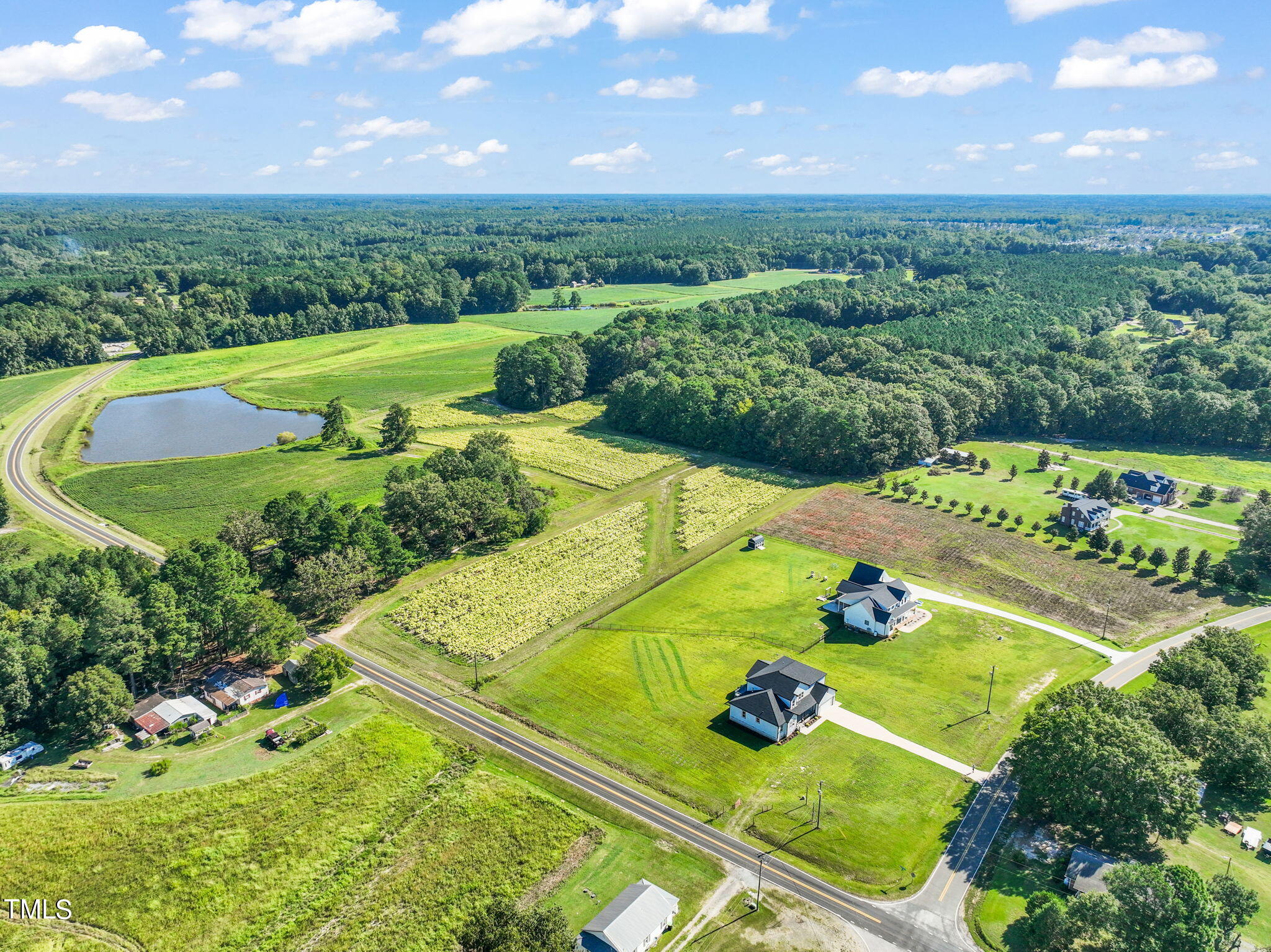 2804 Jack Mitchell Road Zebulon, NC 27597 - Photo 55 of 56 a view of a golf course with an outdoor space