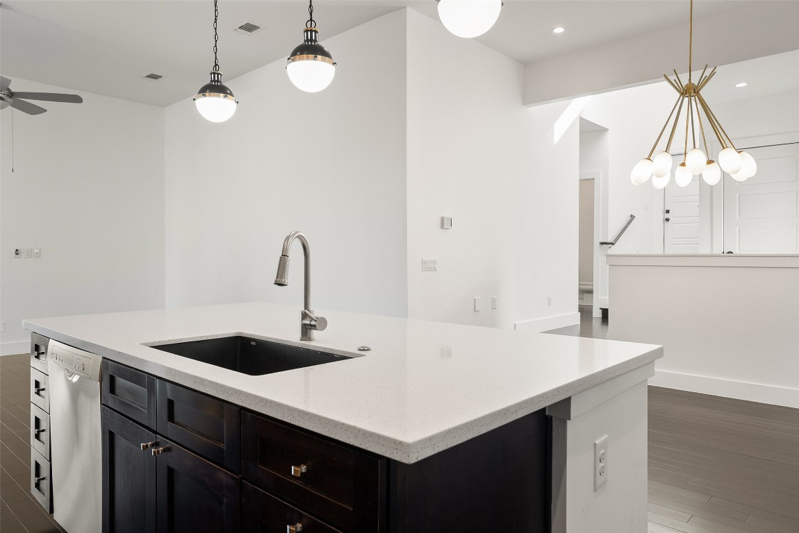1303 Azie Morton Road, Unit 6 Austin, TX 78704 - Photo 20 of 40 a kitchen with a sink a counter and a stove