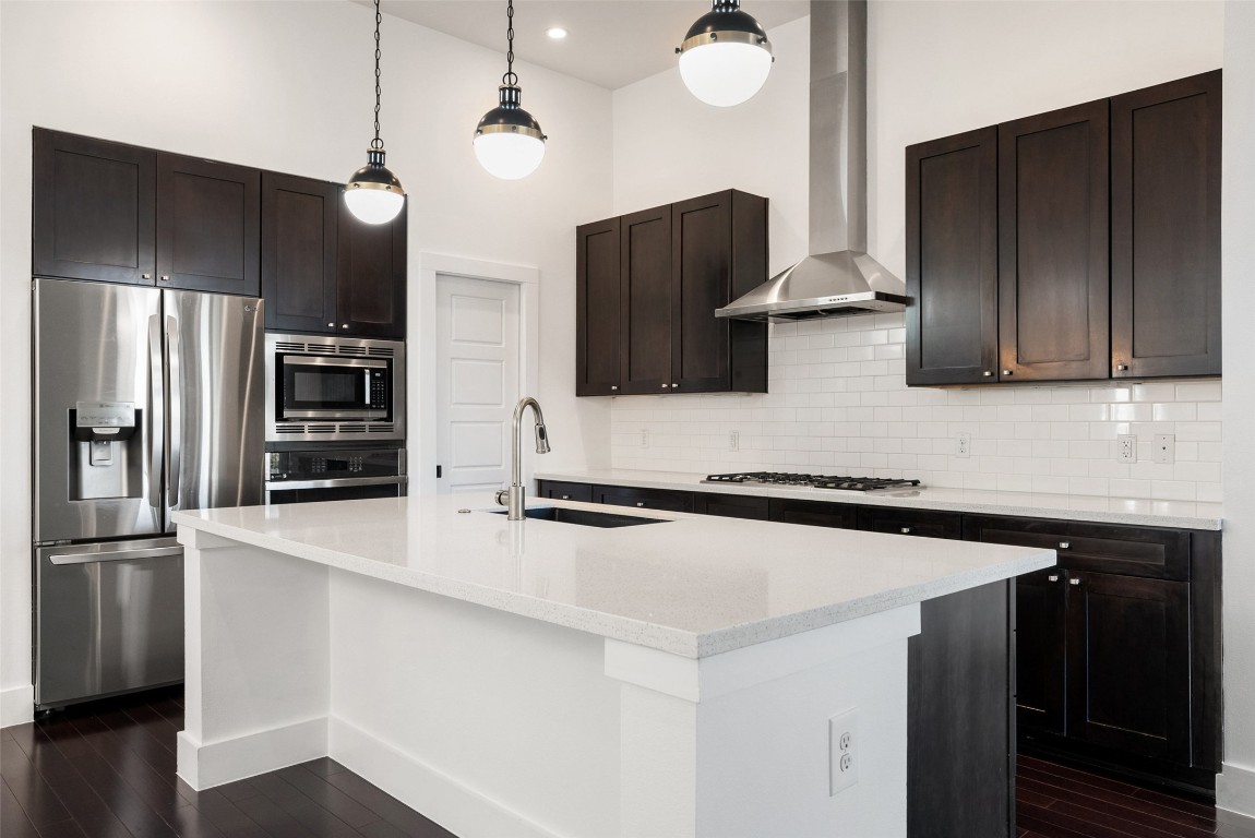 1303 Azie Morton Road, Unit 6 Austin, TX 78704 - Photo 22 of 40 a kitchen with stainless steel appliances a sink and a refrigerator