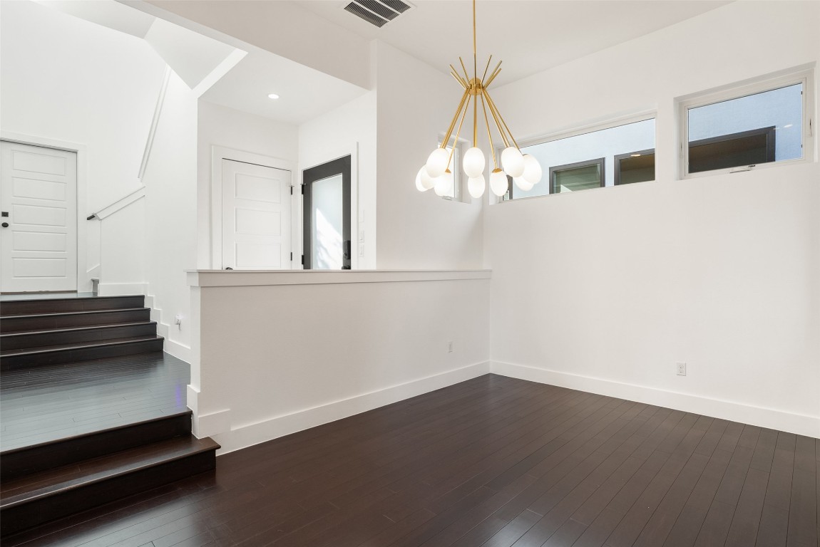 1303 Azie Morton Road, Unit 6 Austin, TX 78704 - Photo 23 of 40 an empty room with wooden floor and windows