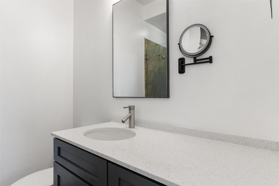 1303 Azie Morton Road, Unit 6 Austin, TX 78704 - Photo 40 of 40 a bathroom with a sink and a mirror