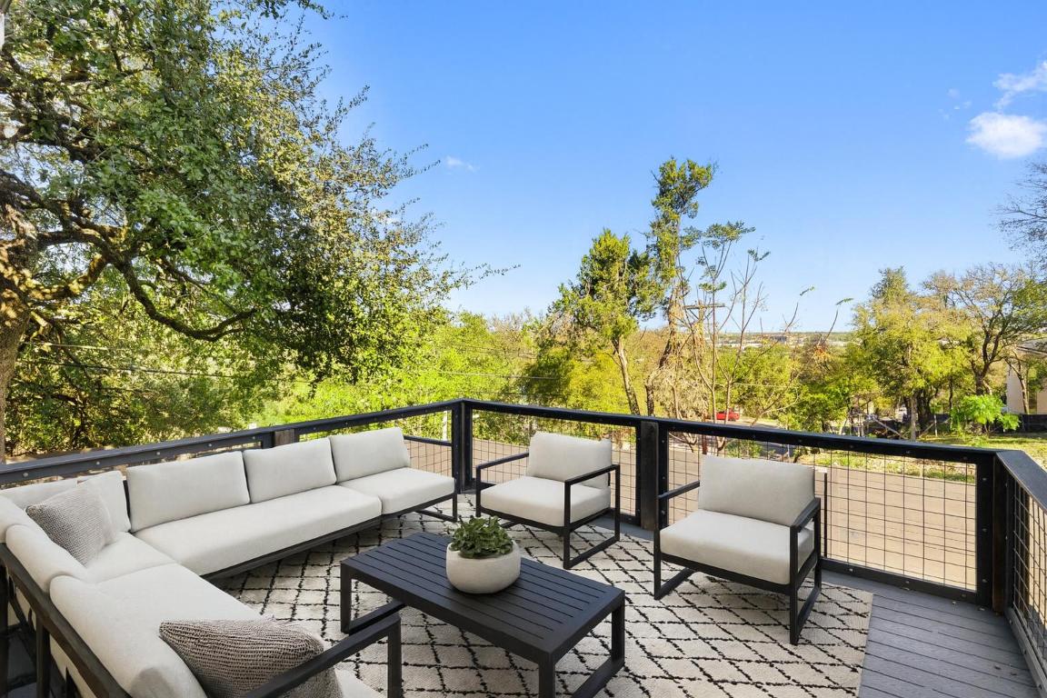1303 Azie Morton Road, Unit 6 Austin, TX 78704 - Photo 10 of 40 a view of a chairs and table on the wooden floor