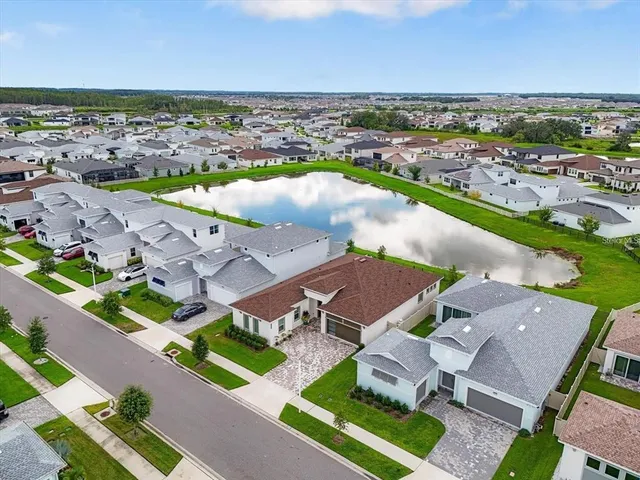 an aerial view of a house with a ocean view