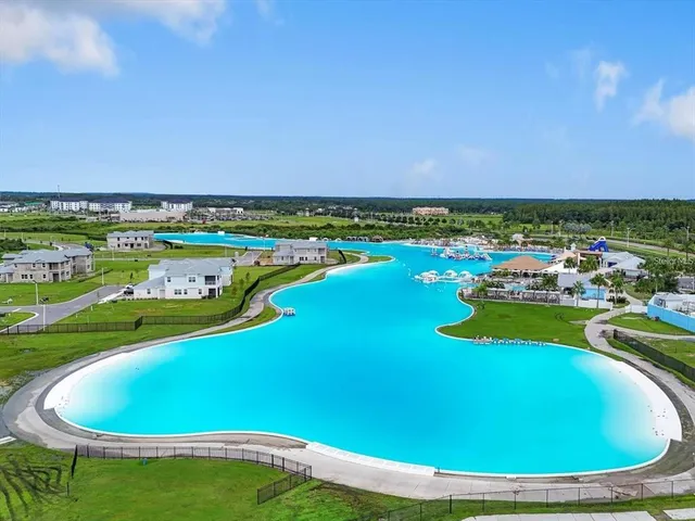 a view of a swimming pool with an outdoor space and seating area